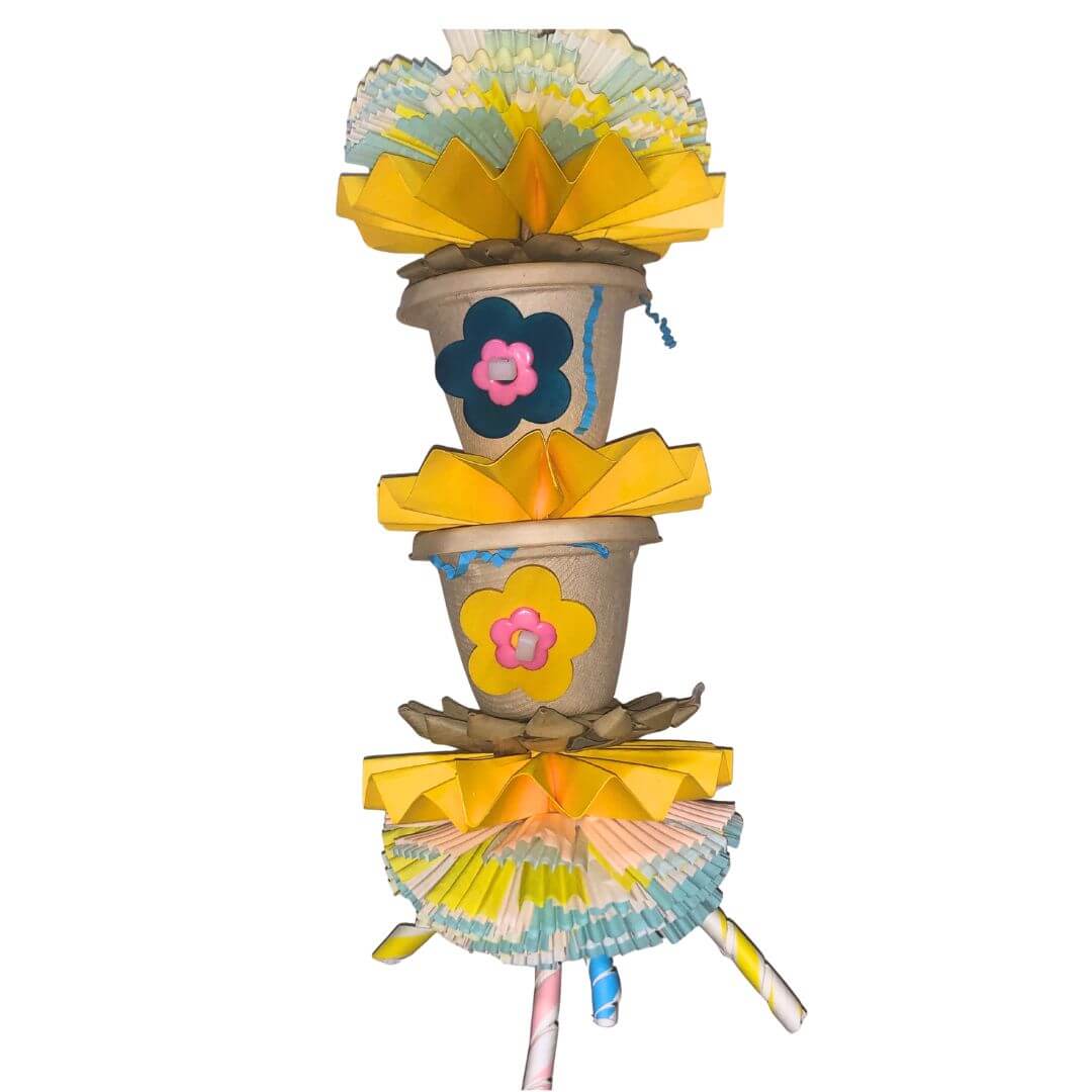 Colorful paper flower bird toys with foraging cups and flowers on a white background