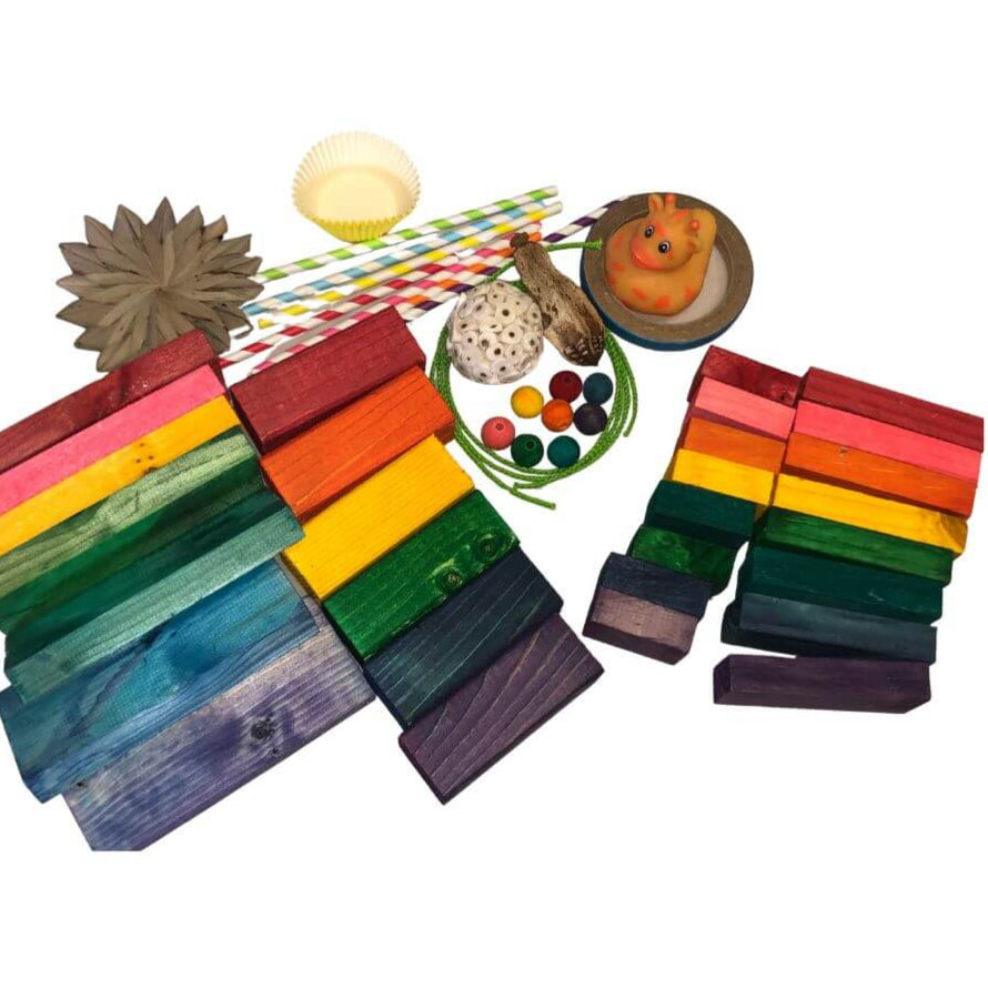 Colorful wooden blocks arranged in a pyramid shape on a white background.