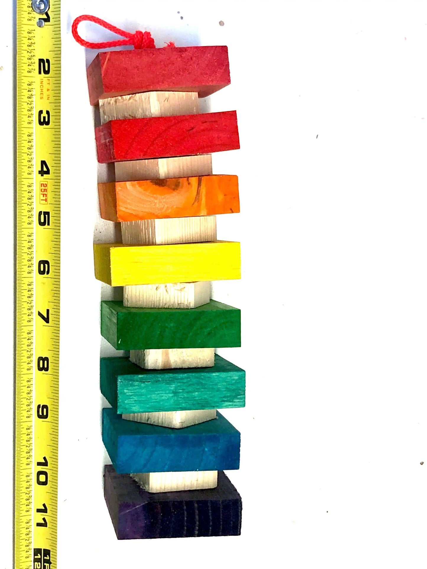 rainbow block bird toy with natural blocks inbetween