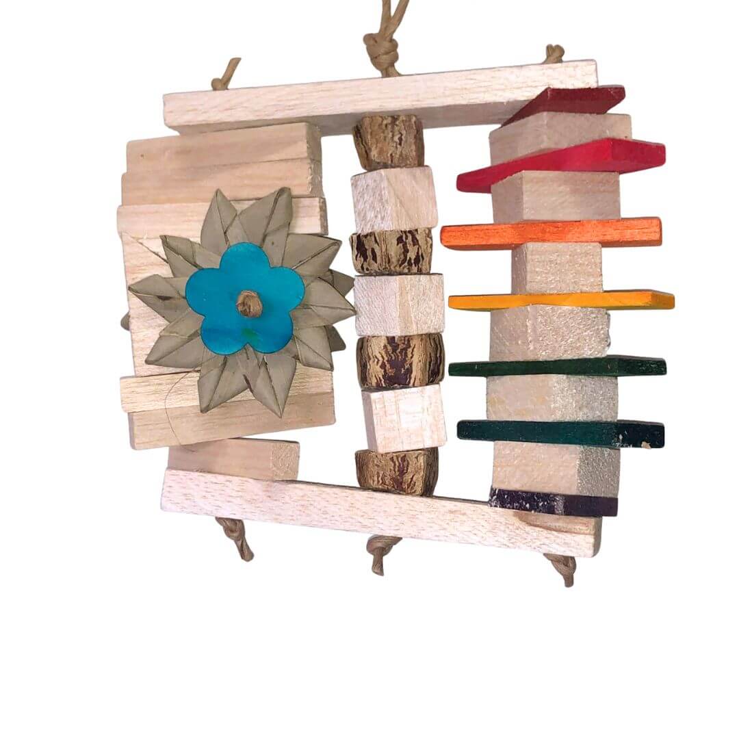 Balsa bird toy with colorful shelves and a flower decoration on a white background