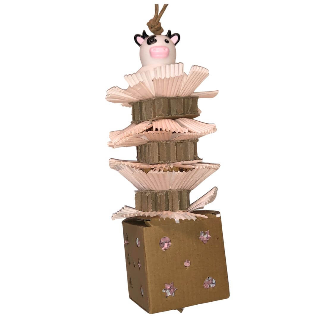 foraging box with cardboard, pods and rubber cow
