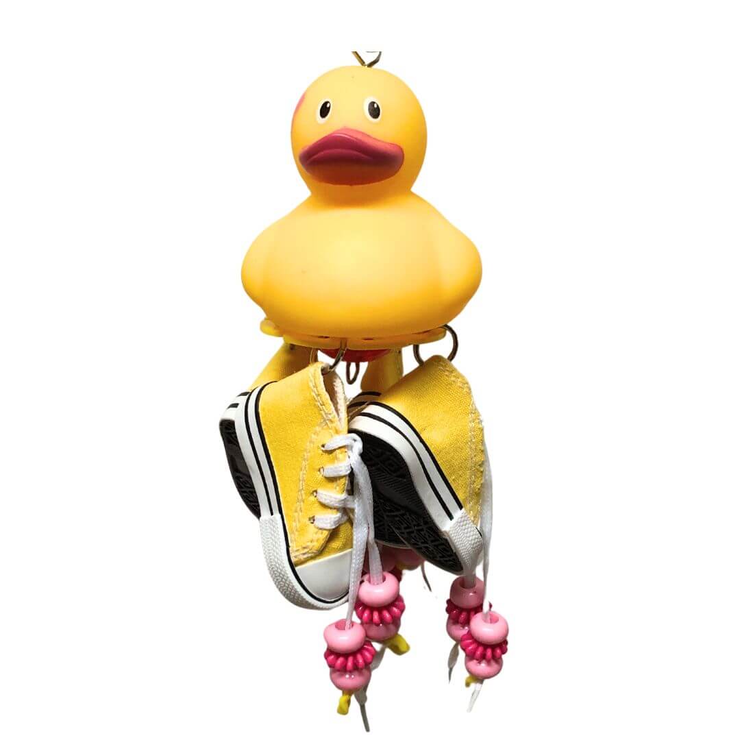 yellow duck with pink flower. Yellow shoes and pink beads and charms
