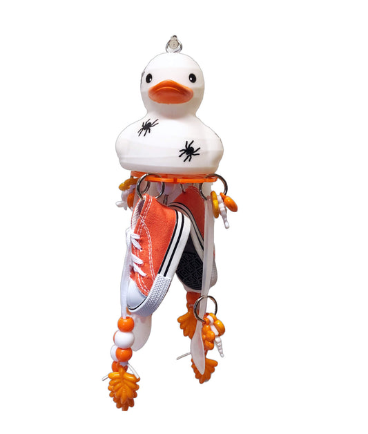 WHite and orange halloween bird toy with shoes and spoons