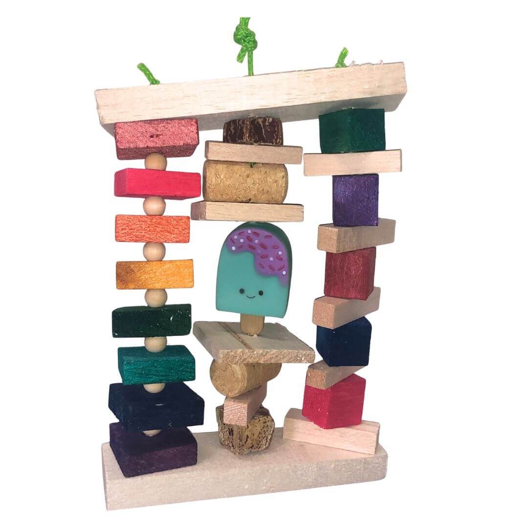 Colorful balsa block tower with a smiley face block on a white background