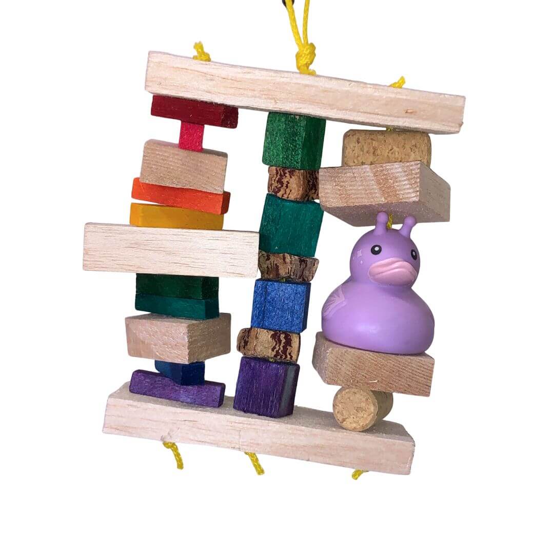 balsa bird toy with a purple duck figure on a white background