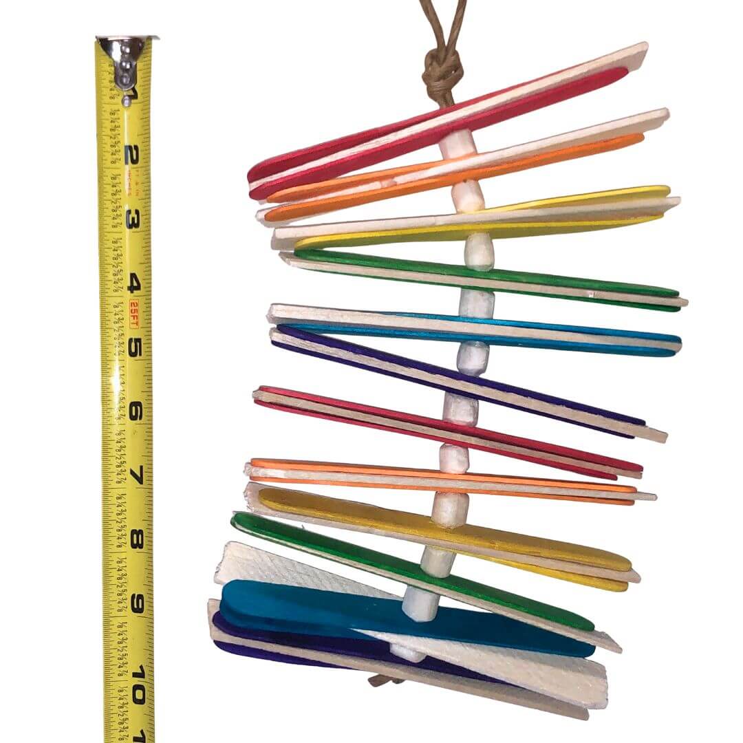 balsa bird toy with popsicle sticks and sola beads. 