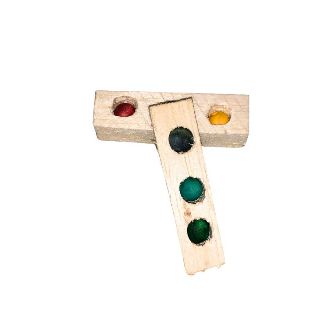 balsa foot toy for birds with beads embedded. 