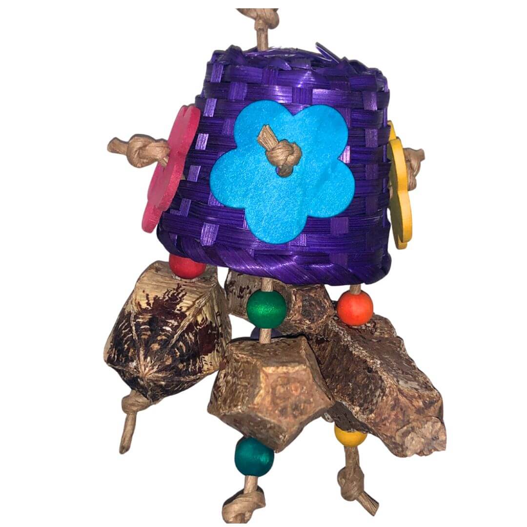 Colorful bird toy with purple basket, flower, and pods elements on a white background