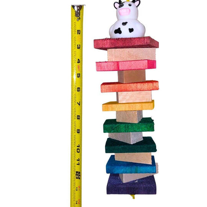 A colorful hanging bird toy made of soft balsa wood with a duck figure on top.