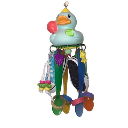 A colorful bird toy resembling a rubber duck with various playful elements such as beads and charms attached foraging and chewing activities.