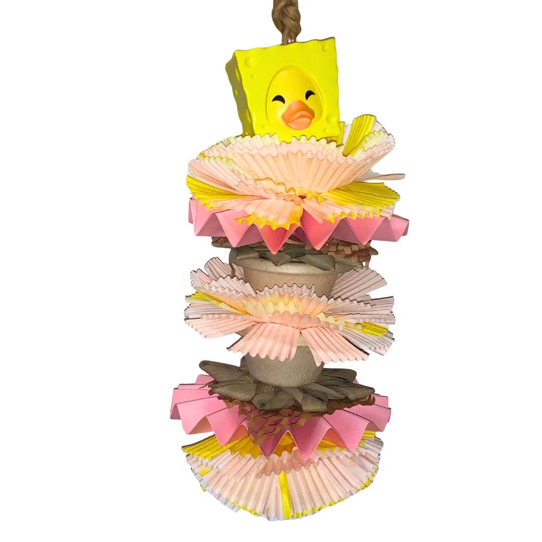 Foraging bird toy  surrounded by colorful paper decorations on a white background.