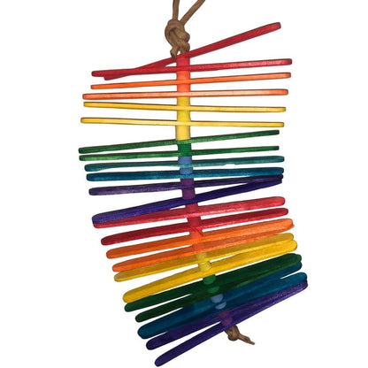 Colorful popsicle bird toy made of interlocking sticks on a white background