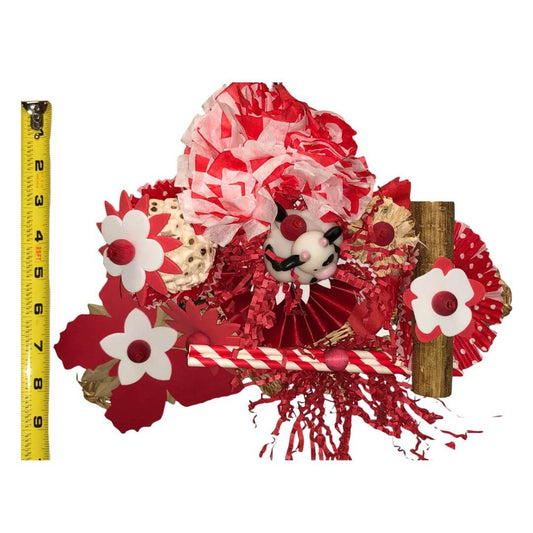 Bird Toy with red and white flowers and a measuring tape for scale on a white background