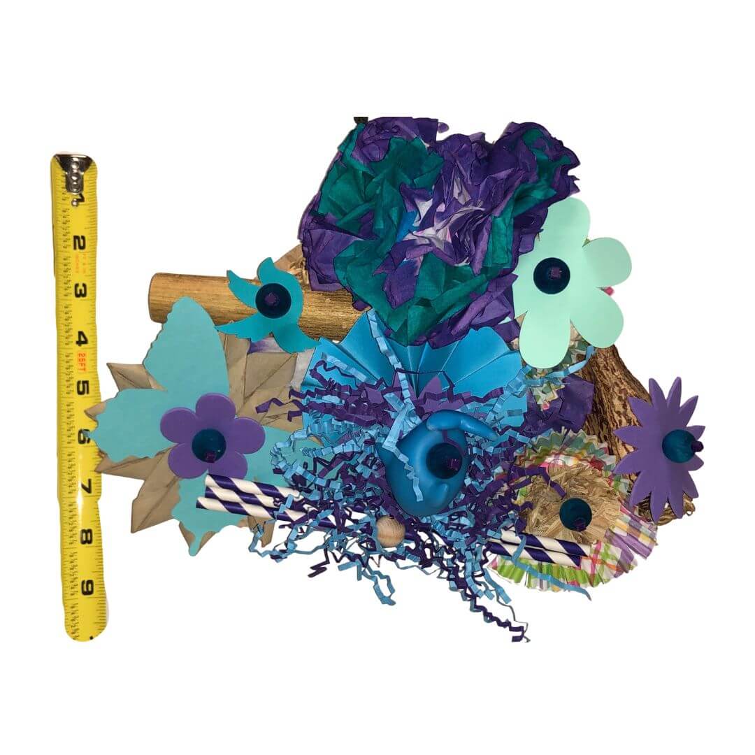 Colorful decorative Bird Toy 
with flowers and a measuring tape on a white background