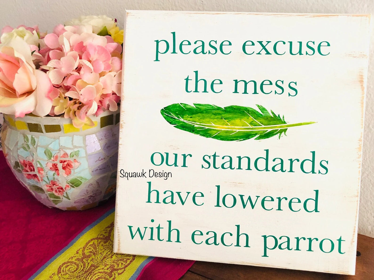 green text and feather parrot wood sign 