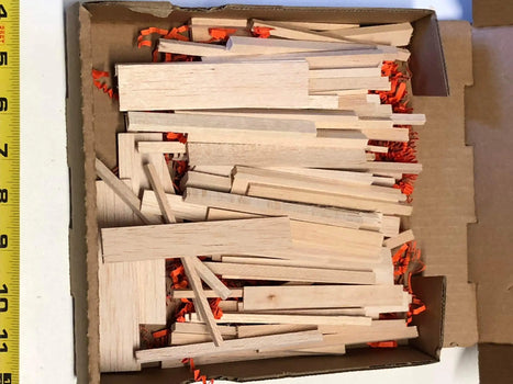 Natural balsa sticks in pizza box