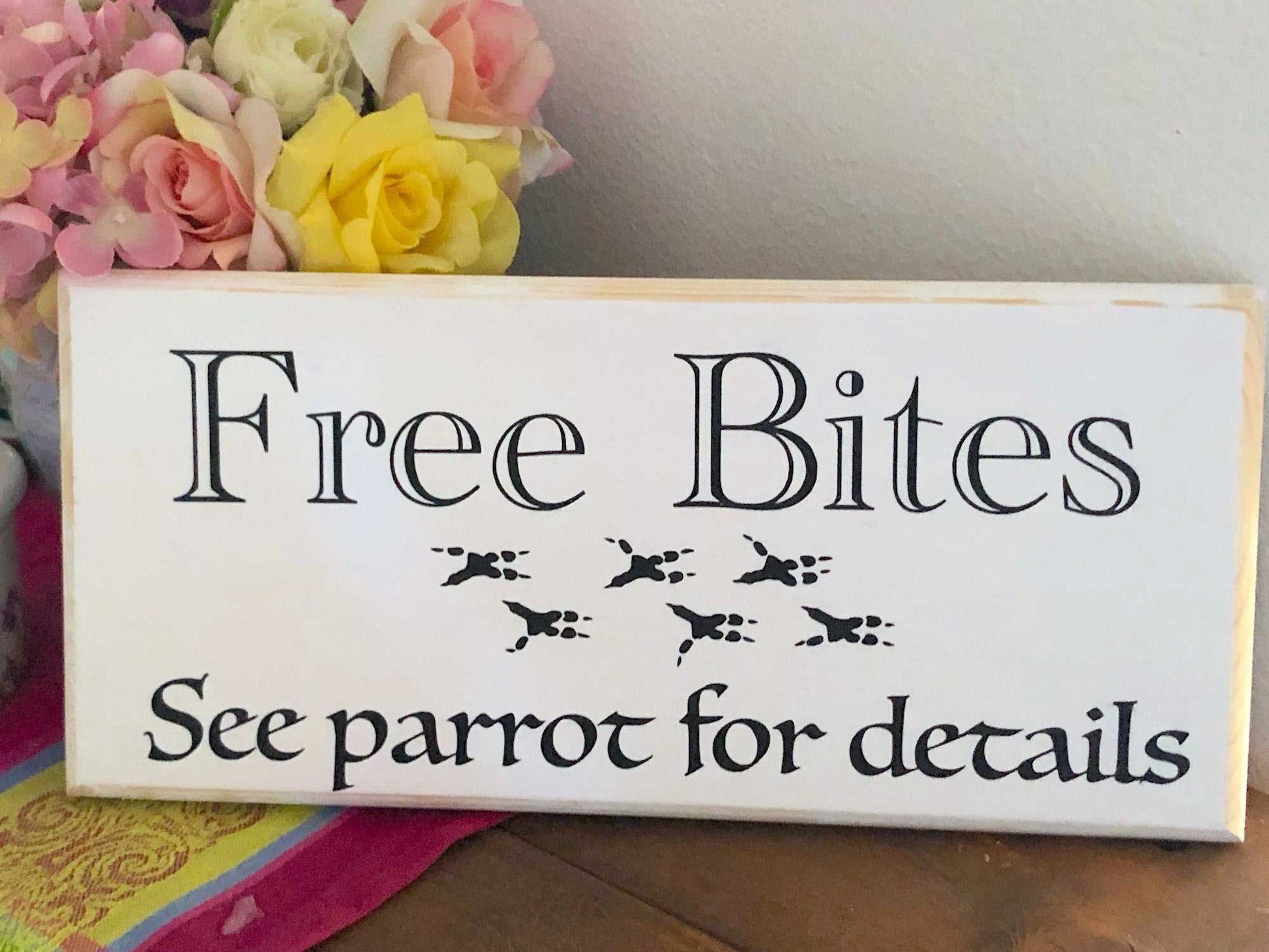 free bites, see parrot for details white wood sign